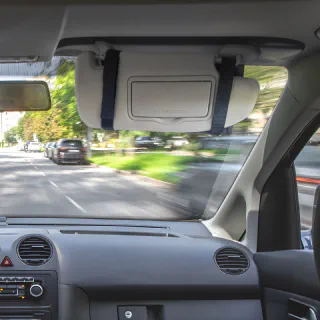 The VisorPlate strapped to a passenger sun visor.